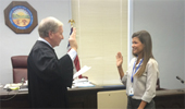 Judge Robert W. Stewart, Athens County Court of Common Pleas, Juvenile Division, swears in Alyssa Nicol as a Court Appointed Special Advocate. Photo courtesy of: Athens CASA/GAL Program