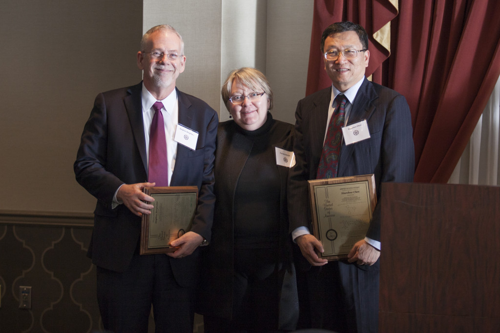 Executive Vice President and Provost Pamela Benoit, center, with inventors Stephen Bergmeier, left, and Xiaozhuo Chen, right. Photo: Kaitlin Owens.