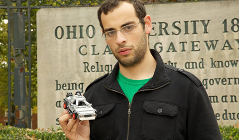 Abdalah El-Barrad holding a model car