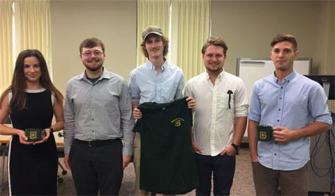 Five Wayne interns stand side by side in classroom