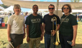Dr. Jennifer Hines, Dr. Travis White, alum Bradley McCullough, and Dr. Jessica White at Homecoming tent.