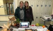 Food Studies students Joy Jostansek and Rachel McDonald pose for a photo at the Food Studies table during the Meet Your Farmers Market.