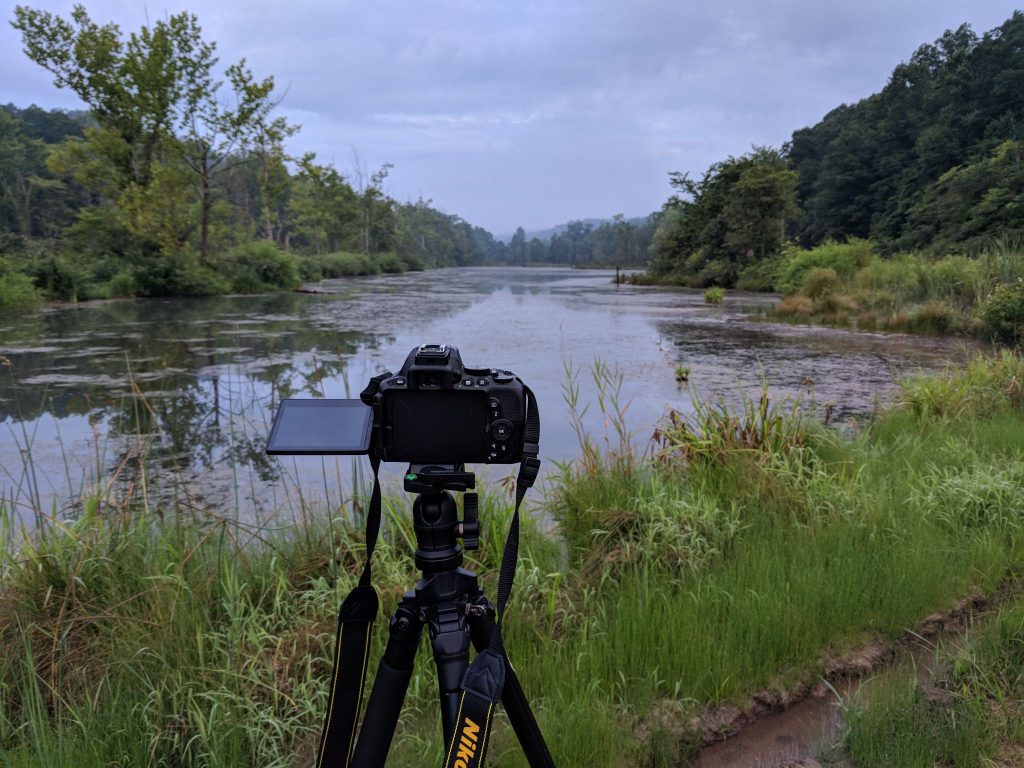 Camera in front of lake